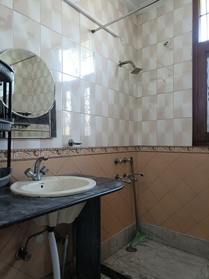 Bathroom in 3 BHK Apartment at Vasant Enclave – for Rent