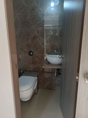 Bathroom in 1 BHK Apartment at Puranik City, Kasarvadavali – for Rent