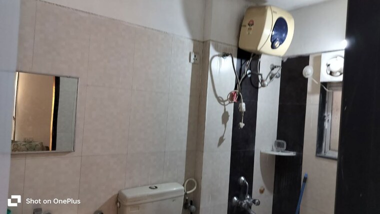 Bathroom, phadnis-sahil-serene 2 Bedroom 1000 Sq.Ft. Apartment In Baner Pune 10376858