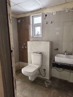 Bathroom in 3 BHK Apartment at Sikka Kaamna Greens, Sector 143a Noida – for Rent