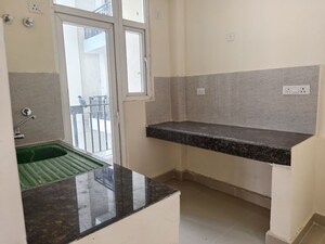 Kitchen in 2 BHK Apartment at Sikka Karnam Greens, Sector 143b – for Rent