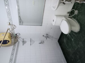 Bathroom in 2 BHK Apartment at Eros Sterling Apartments, Charmwood Village – for Rent