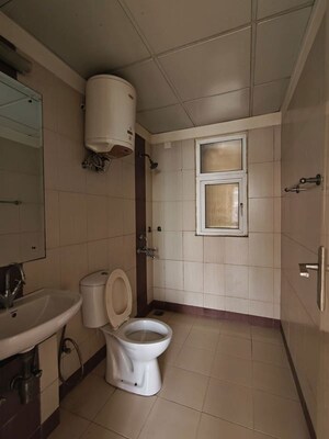Bathroom in 2.5 BHK Apartment at Mahindra Aura Phase III, Sector 110a – for Rent