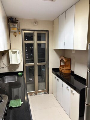 Kitchen in 2 BHK Apartment at Kiran Towers, Malad West – for Rent