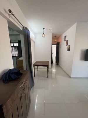 Living Room in 2 BHK Apartment at Roshan Milestone, Tathawade – for Rent