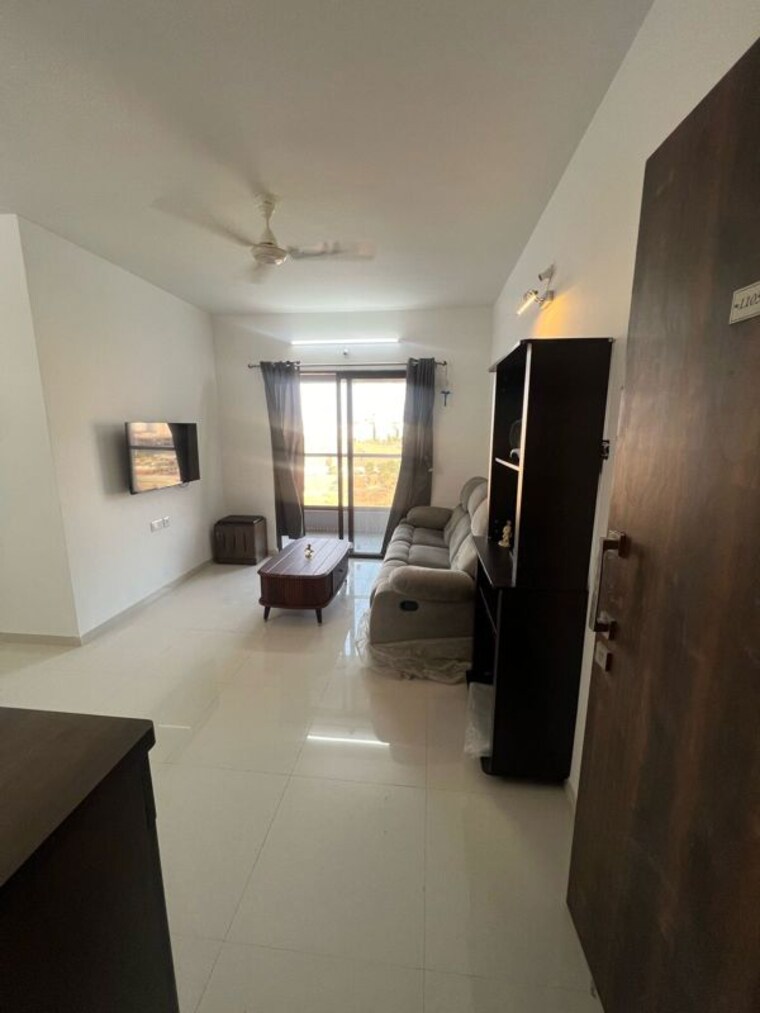 Living Room, roshan-milestone 2 Bedroom 720 Sq.Ft. Apartment In Tathawade Pune 10377347