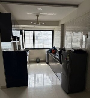 Kitchen in 2 BHK Apartment at Venus Upvan CHS, Gawand Baug – for Rent