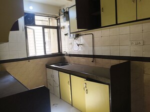 Kitchen in 2 BHK Apartment at Rustomjee Riviera, Malad West – for Rent