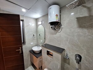 Bathroom in Studio Apartment at Ansal API Esencia, Sector 67 – for Rent