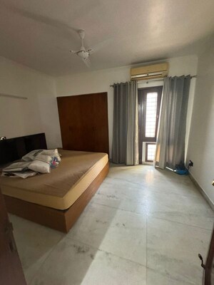 Bedroom in 4 BHK Builder Floor at Nehru Enclave – for Rent