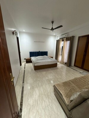 Bedroom in 4 BHK Builder Floor at Nehru Enclave – for Rent