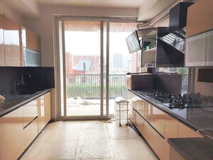 Kitchen in 4 BHK Apartment at Emaar Orange Castle, Gomti Nagar – for Rent