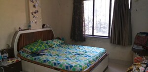 Bedroom in 1 BHK Apartment at Prasad Apartment Dahanukar Colony, Kothrud – for Rent
