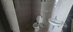 Bathroom in 2 BHK Apartment at Devika Skypers, Raj Nagar Extension – for Rent