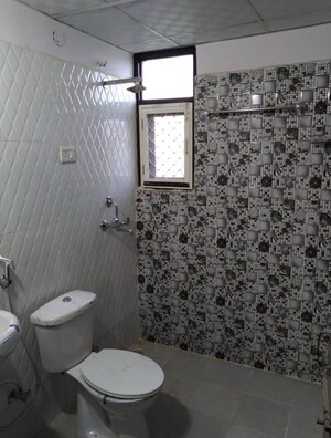 Bathroom in 2 BHK Apartment at Devika Skypers, Raj Nagar Extension – for Rent