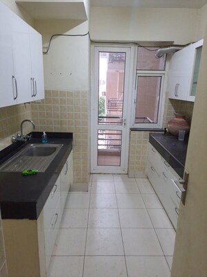 Kitchen in 3 BHK Apartment at Mahindra Aura, Sector 110a – for Rent