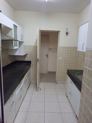 Kitchen in 3 BHK Apartment at Mahindra Aura, Sector 110a – for Rent