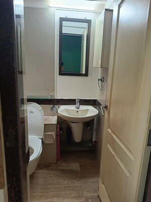 Bathroom in 3 BHK Apartment at K Raheja Heights, Malad East – for Rent