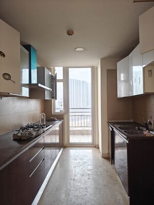 Kitchen in 3 BHK Apartment at Puri Diplomatic Greens Phase I, Sector 111 – for Rent