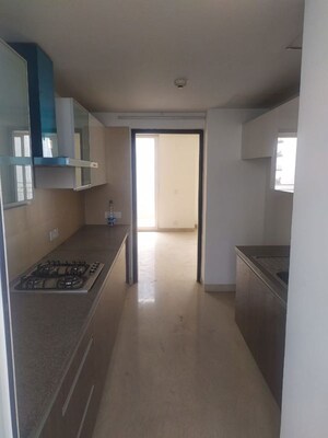 Kitchen in 3 BHK Apartment at Puri Diplomatic Greens Phase I, Sector 111 – for Sale