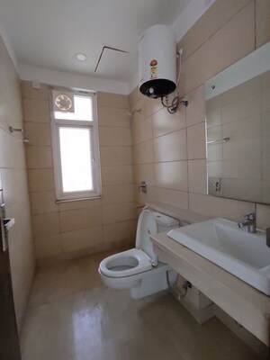 Bathroom in 3.5 BHK Apartment at Puri Diplomatic Greens Phase I, Sector 111 – for Rent