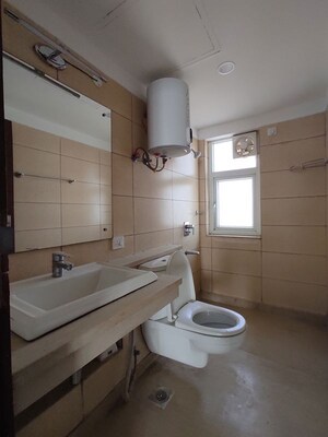 Bathroom in 4 BHK Apartment at Puri Diplomatic Greens Phase I, Sector 111 – for Sale