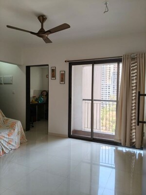 Living Room in 1 BHK Apartment at Runwal Garden City, Balkum Pada – for Rent
