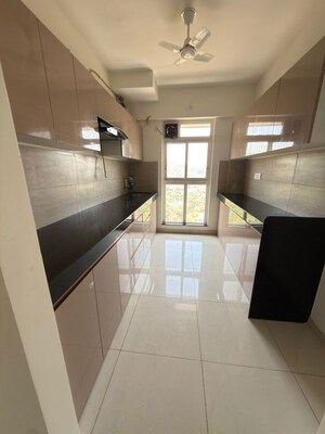 Kitchen in 3 BHK Apartment at Godrej Emerald, Ghodbunder Road – for Rent