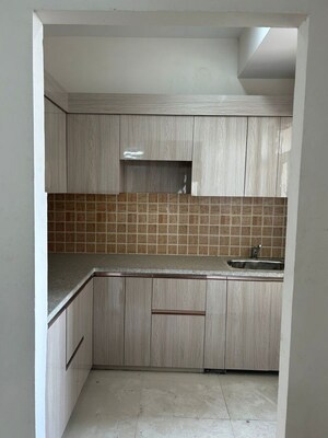 Kitchen in 2 BHK Apartment at Mahagun My Woods, Sector 16c Greater Noida – for Rent