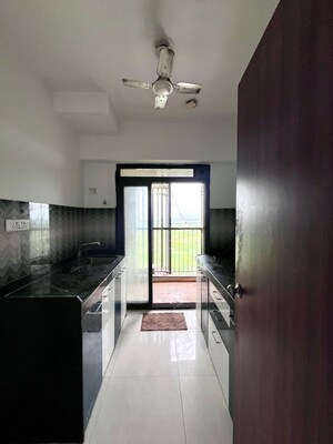 Kitchen in 2 BHK Apartment at Lodha Splendora, Ghodbunder Road – for Sale