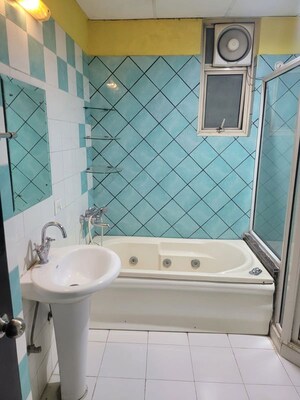 Bathroom in 4 BHK Apartment at Grand Omaxe, Gomti Nagar – for Sale