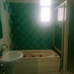 Bathroom in 4 BHK Apartment at Grand Omaxe, Gomti Nagar – for Sale