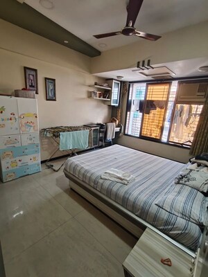 Bedroom in 2 BHK Apartment at Darshan Heights, Charni Road – for Sale