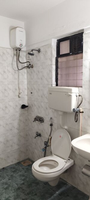 Bathroom in 4 BHK Apartment at Montreal Tower, Andheri West – for Sale