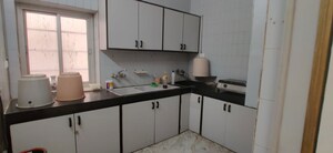 Kitchen in 3 BHK Apartment at Gita Society, Camp – for Sale