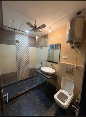 Bathroom in 4 BHK Builder Floor at Pamposh Enclave – for Rent