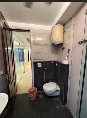 Bathroom in 4 BHK Builder Floor at Pamposh Enclave – for Rent