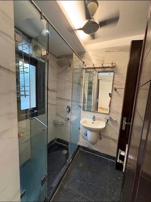 Bathroom in 4 BHK Builder Floor at Pamposh Enclave – for Rent