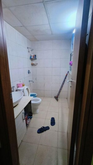 Bathroom in 2 BHK Apartment at Bhartiya Nikoo Homes Phase 2, Thanisandra Main Road – for Rent