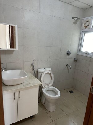 Bathroom in 2 BHK Apartment at Bhartiya Nikoo Homes Phase 2, Thanisandra Main Road – for Rent