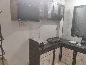 Kitchen in 2 BHK Apartment at Mukta Residency Phase 2, Shilphata – for Rent
