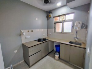Kitchen in 1 BHK Apartment at Hiranandani Estate Solitaire C, Ghodbunder Road – for Sale