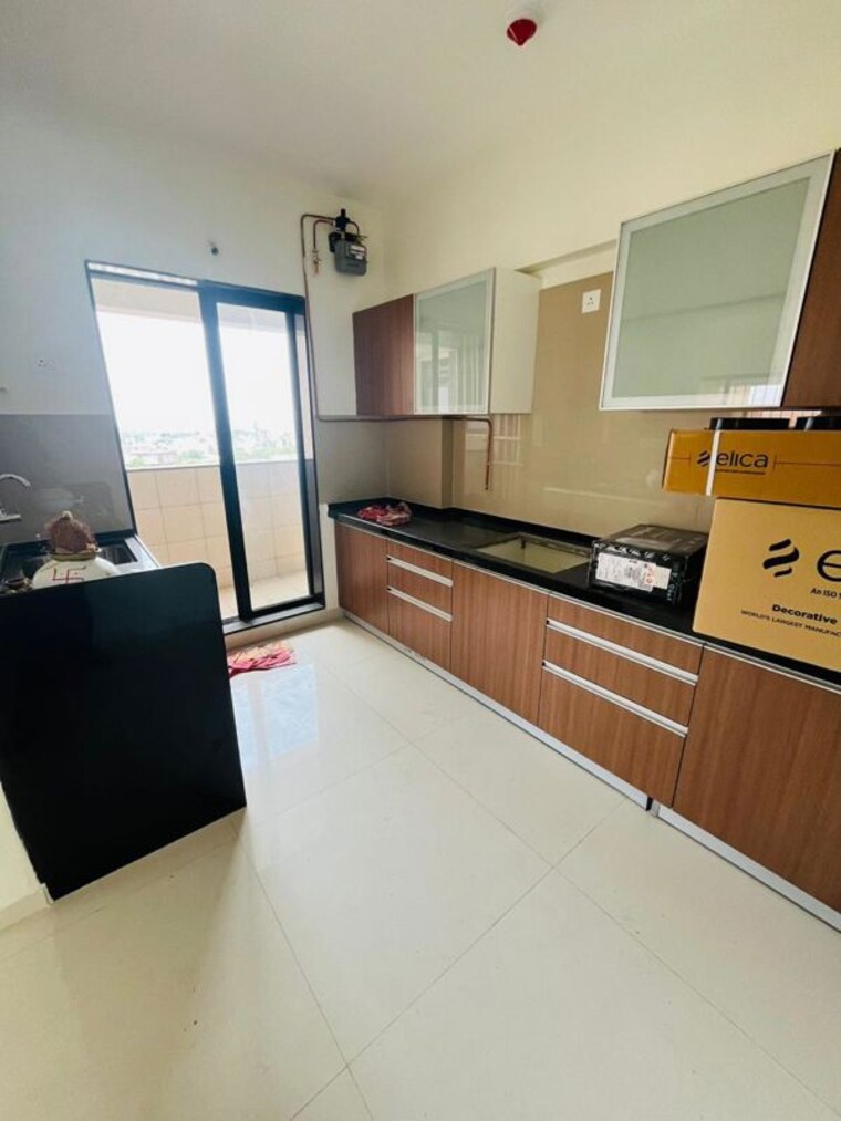 Kitchen, bhojwani-the-west-ford 3 Bedroom 1200 Sq.Ft. Apartment In Pimple Saudagar Pune 10384382