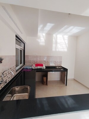 Kitchen in 2 BHK Apartment at Mahavir Square, Manpada – for Sale