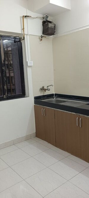 Kitchen in 2 BHK Apartment at Montreal Tower, Andheri West – for Rent