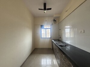 Kitchen in 2 BHK Apartment at Vihang Valley Phase 2, Kasarvadavali – for Sale