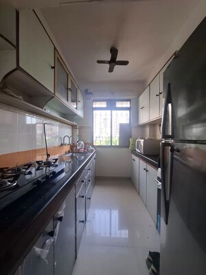 Kitchen in 2 BHK Apartment at Lodha Paradise, Majiwada – for Rent