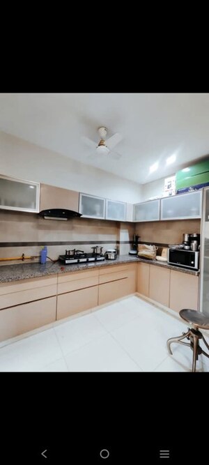 Kitchen in 3 BHK Apartment at Shivalik Sharda Park View, Shela – for Rent