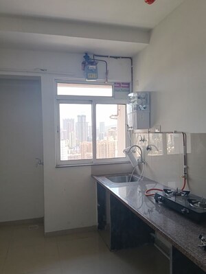 Kitchen in 1 BHK Apartment at Puranik City Reserva, Ghodbunder Road – for Rent