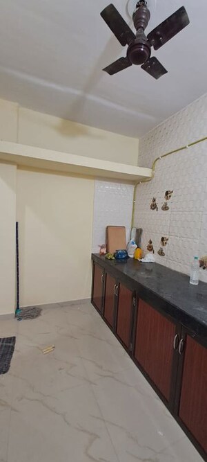 Kitchen in 2 BHK Apartment at Pranjee Garden City, Katrap – for Rent